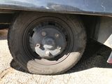 a close up of a flat tire on a truck