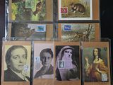 many different pictures of women and animals on a table