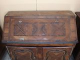 a small wooden desk with a drawer on top of it