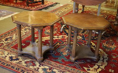 two tables that are sitting on a rug in a room