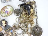 a pile of assorted jewelry sitting on a table