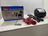 a box with a charger and a car charger on a counter