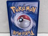 a close up of a nintendo game case with a pokemon ball on it