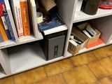 a computer desk with a laptop on top of it