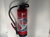 a fire extinguisor attached to a wall in a room