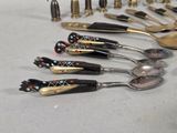 a lot of spoons and spoon spoons on the table