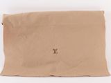 a louis vu bag with a small logo on the front