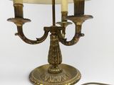 a lamp that is sitting on a table next to a lamp shade