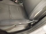 a seat in the back of a car with a seat belt down