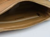 a close up of a purse on a table