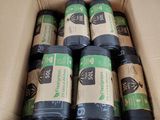 six rouleaux de ruban adhésif noir et vert dans une boîte en carton