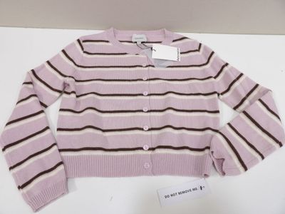 pink and brown striped cardigan sweater sitting on a white table