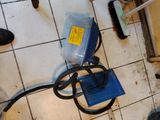 a picture of a dirty bathroom floor with a cluttered floor