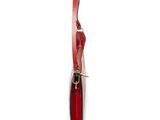 a red knife with a gold handle on a white surface