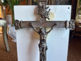a silver cross with a crucifix on it