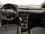 the interior of a car with a steering wheel and dashboard controls