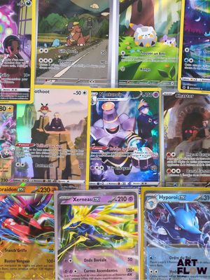 a lot of pokemon cards that are on the table