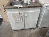 a small kitchen with a sink and a dishwasher in it