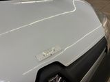 a close up of a car ' s hood with a sticker on it