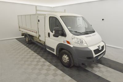 a white truck that is parked in a garage