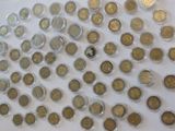 a lot of coins that are on the table