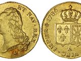une pièce souveraine en or surmontée d'une couronne