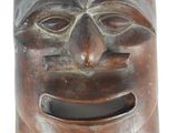 an image of a wooden mask on a white background