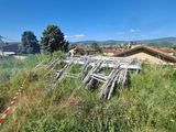 a pile of chairs sitting on the side of a hill