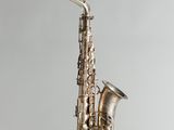 a close up of a saxophone on a white background