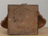 an old wooden box sitting on top of a wooden table