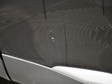 a close up of a car ' s door handle and door handle