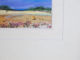 a picture of a painting of a beach scene in a frame