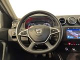 the interior of a car with a steering wheel and dashboard controls