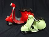 two figurines of a motor scooter and a moped