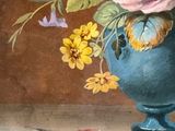 a painting of flowers in a blue vase on a ledge