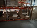 many boxes on the shelves in the warehouse