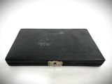 a black briefcase sitting on a white surface