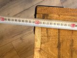 a ruler that is on top of a piece of wood