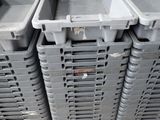 several plastic containers stacked on top of each other on a pallet