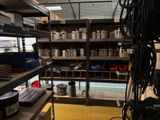a room with a lot of shelves and a lot of tools