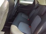 the back seats of a car are black and grey in color