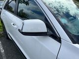 a white car that is parked in a parking lot