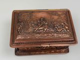an antique copper box with a scene of a man and a woman in a forest