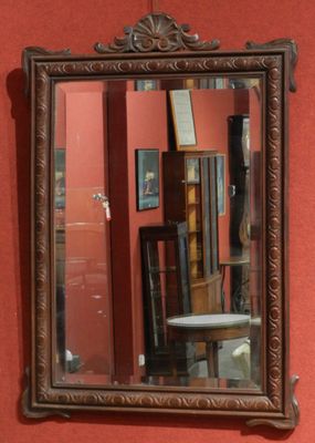 a mirror hanging on the wall in a room