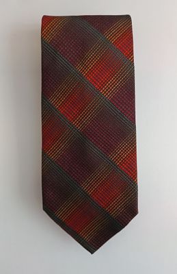 an image of a red and brown tie hanging on a wall