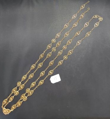 a gold chain with a medallion design on it