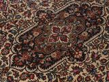 a close up of a carpet with a flower design on it