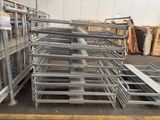 many racks of metal in a warehouse with a lot of boxes