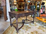 a table that is sitting on a rug in a room
