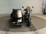 a motorcycle with a side car in a garage